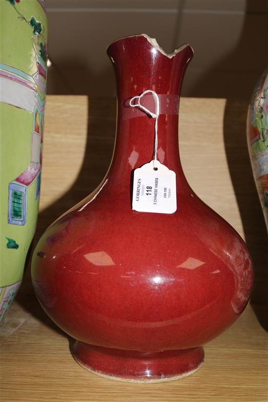 Two large 19th century Chinese famille rose vases and a sang-de-boeuf vase, H 32-58cm (3, all damaged)